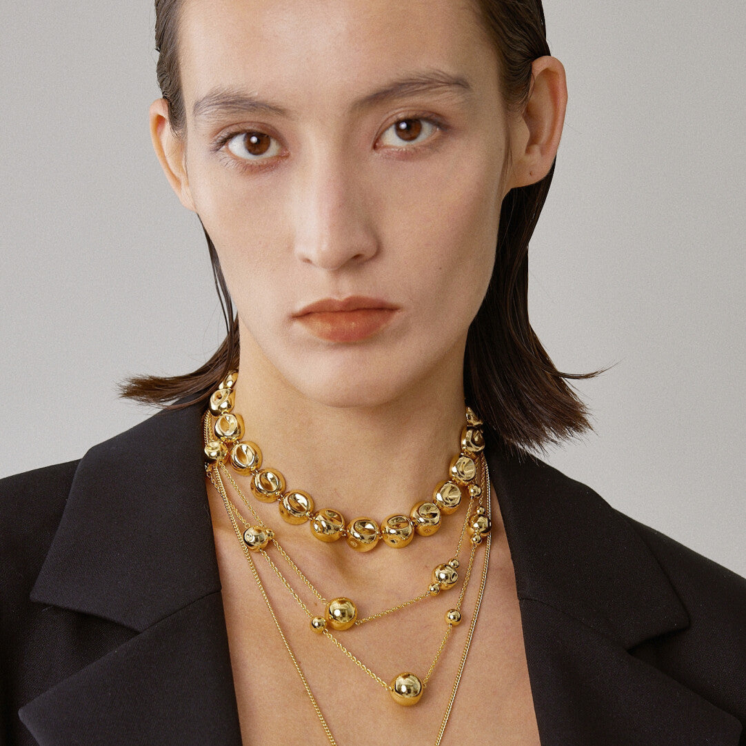 Dented Gold Sphere Long Necklace