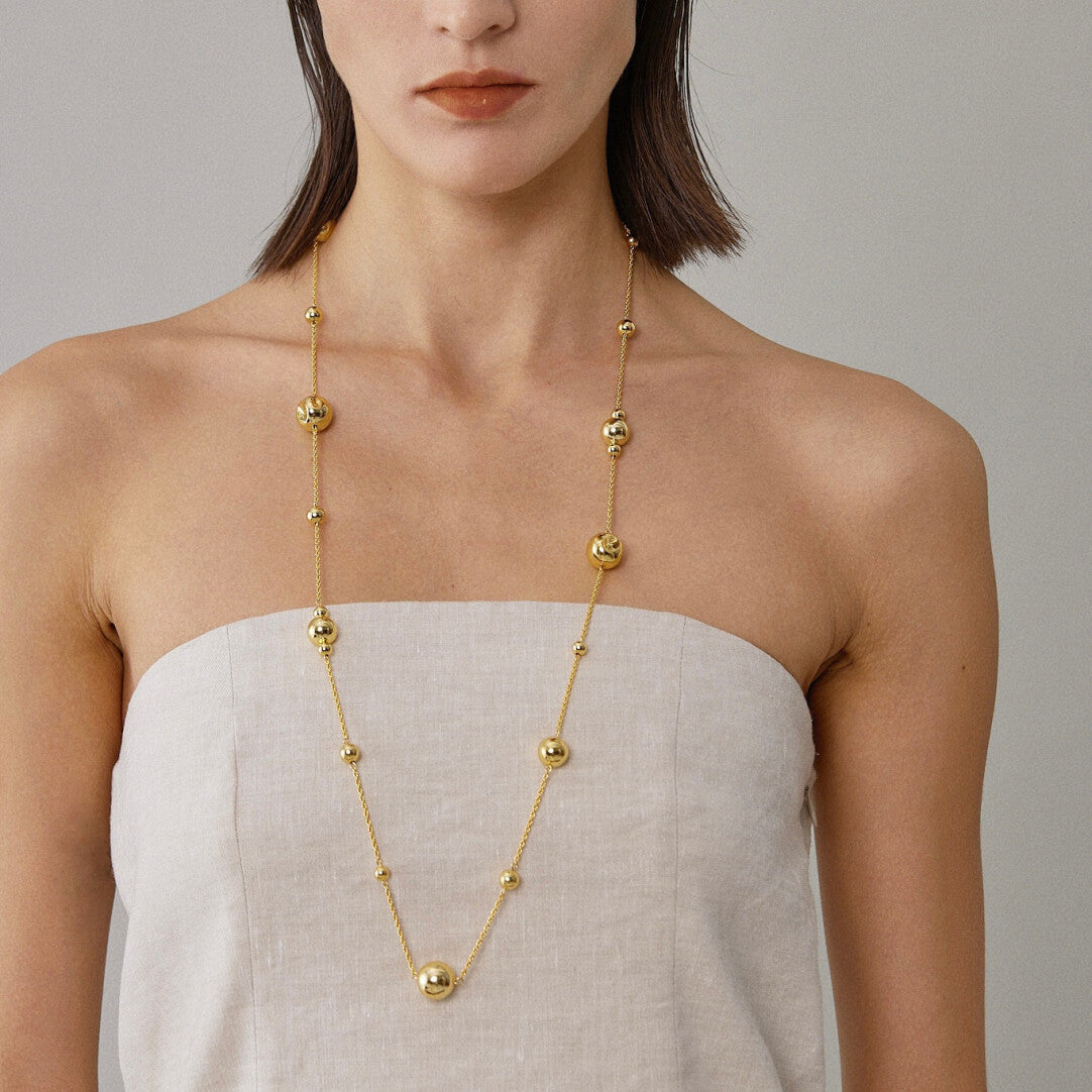 Dented Gold Sphere Long Necklace